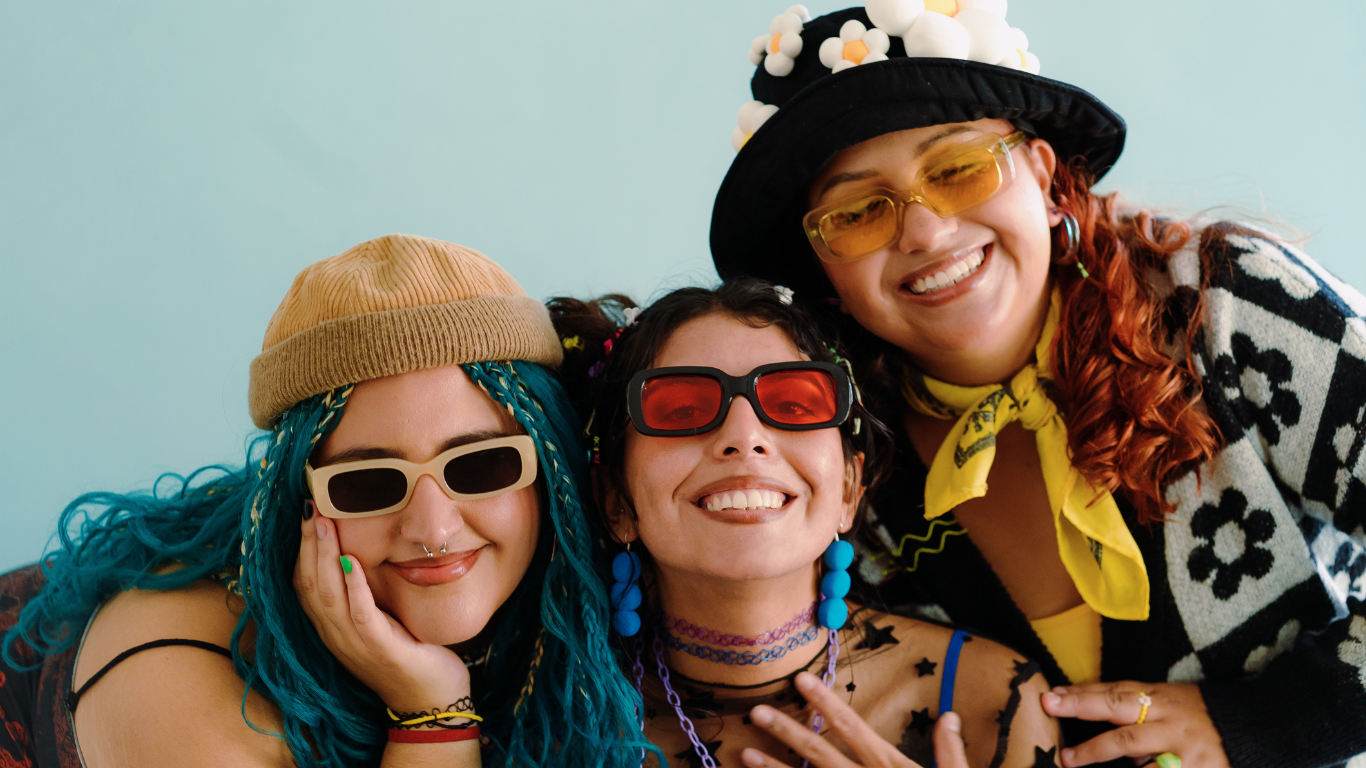 3 female friends from ADHD support group smiling for a group photo